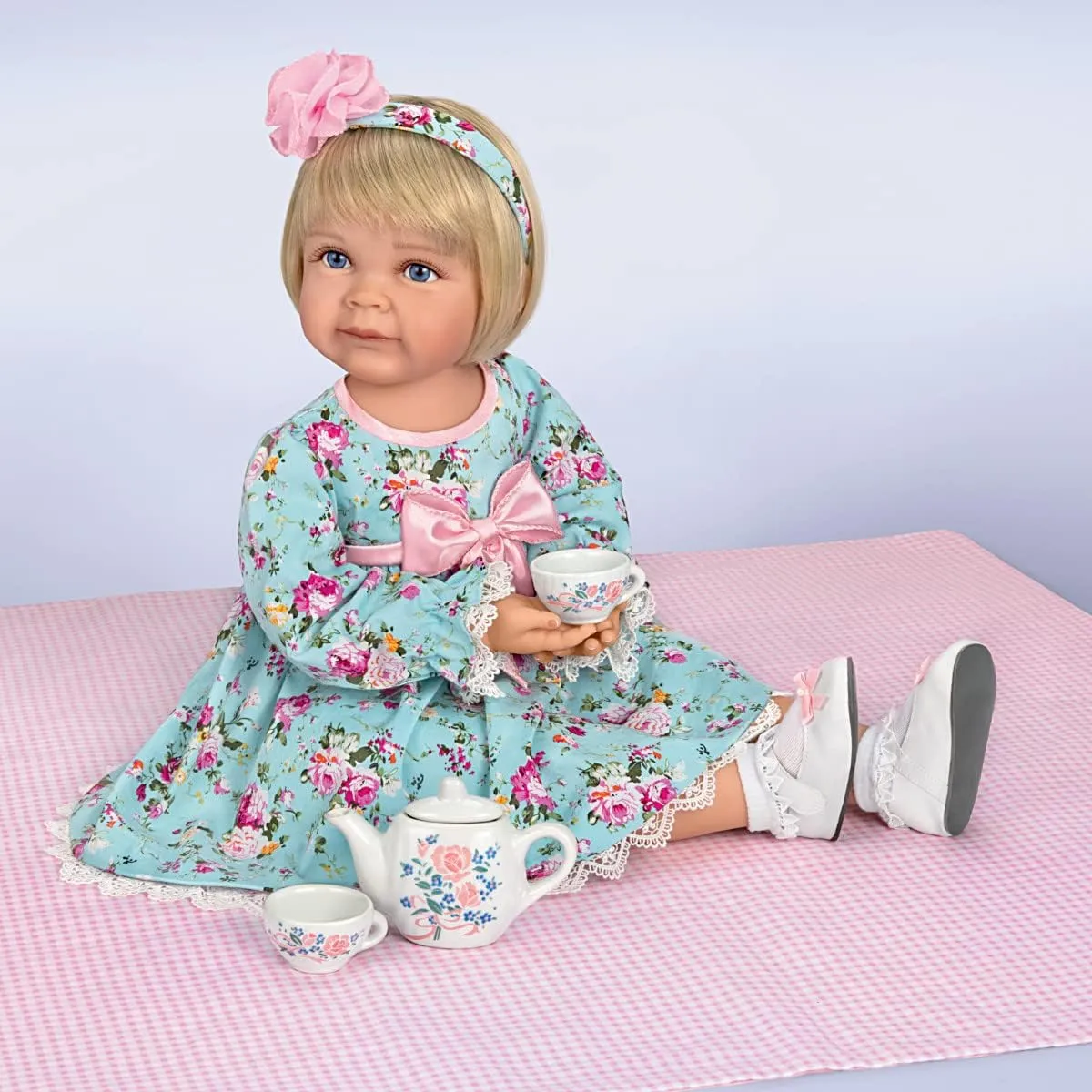 The Ashton-Drake Galleries So Truly Real Tea for Two Toddler Girl Doll Featuring A Finely Tailored Floral Ensemble and Comes with A 3-Piece Porcelain Tea Set and Picnic Blanket