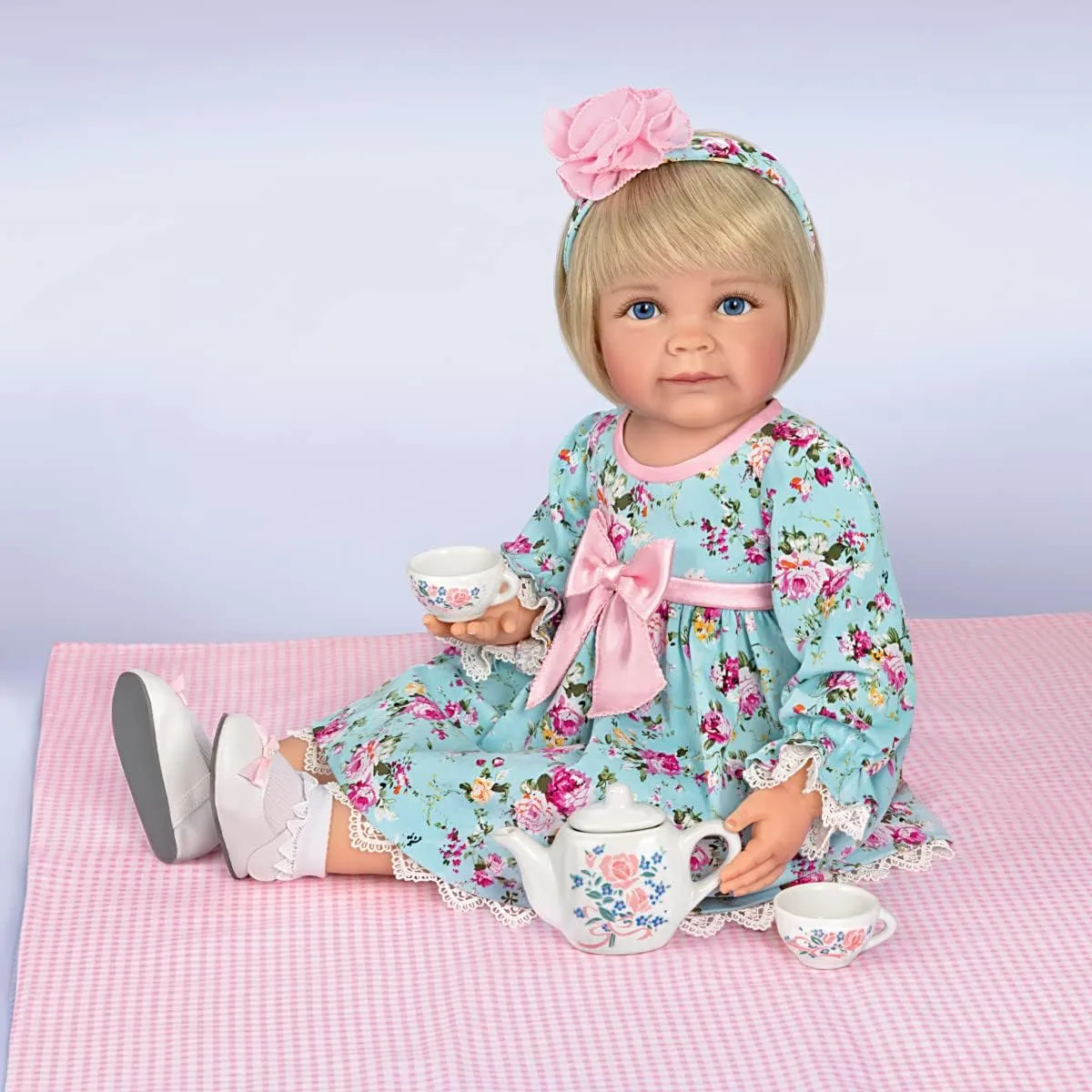 The Ashton-Drake Galleries So Truly Real Tea for Two Toddler Girl Doll Featuring A Finely Tailored Floral Ensemble and Comes with A 3-Piece Porcelain Tea Set and Picnic Blanket